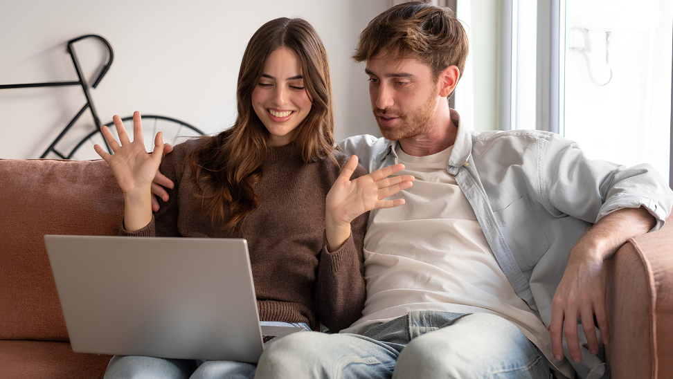 young man and woman with laptop